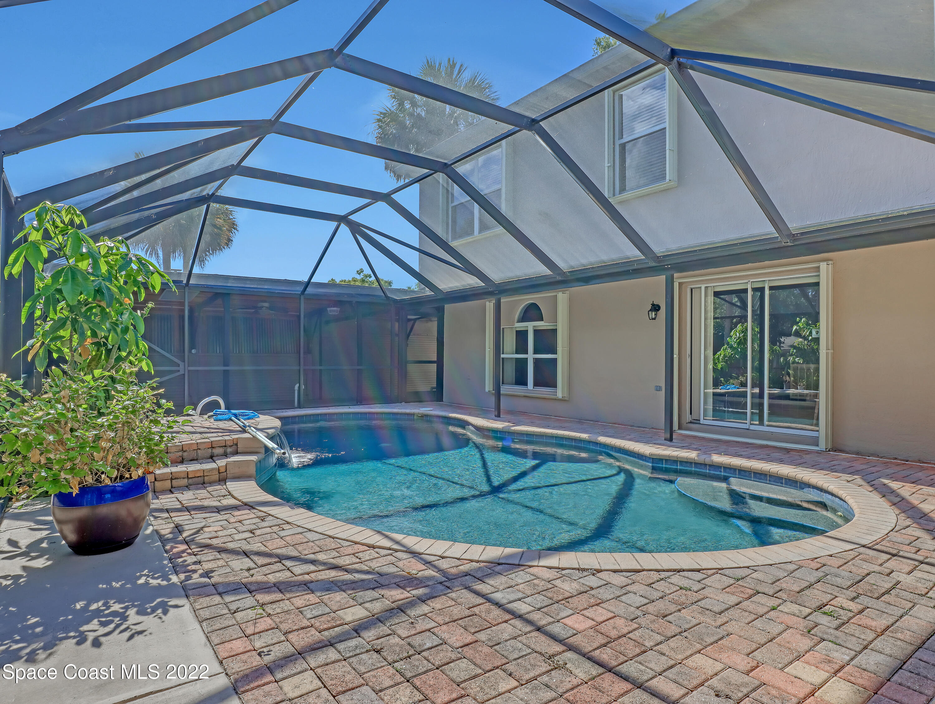 4764 Doreen Road Cocoa, FL 32927 - Photo 38 of 54 a view of a backyard with table and chairs potted plants