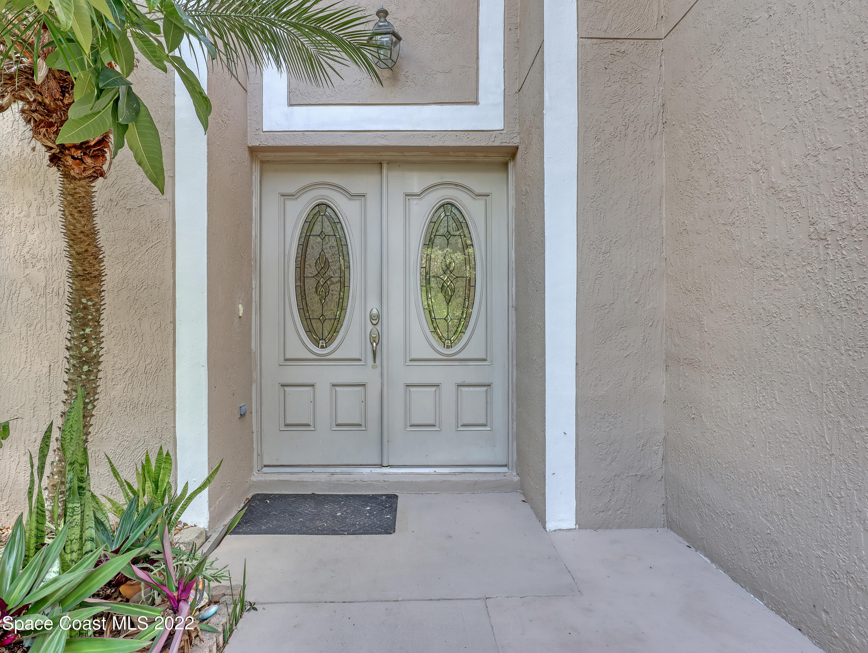4764 Doreen Road Cocoa, FL 32927 - Photo 4 of 54 a front view of a house with garden