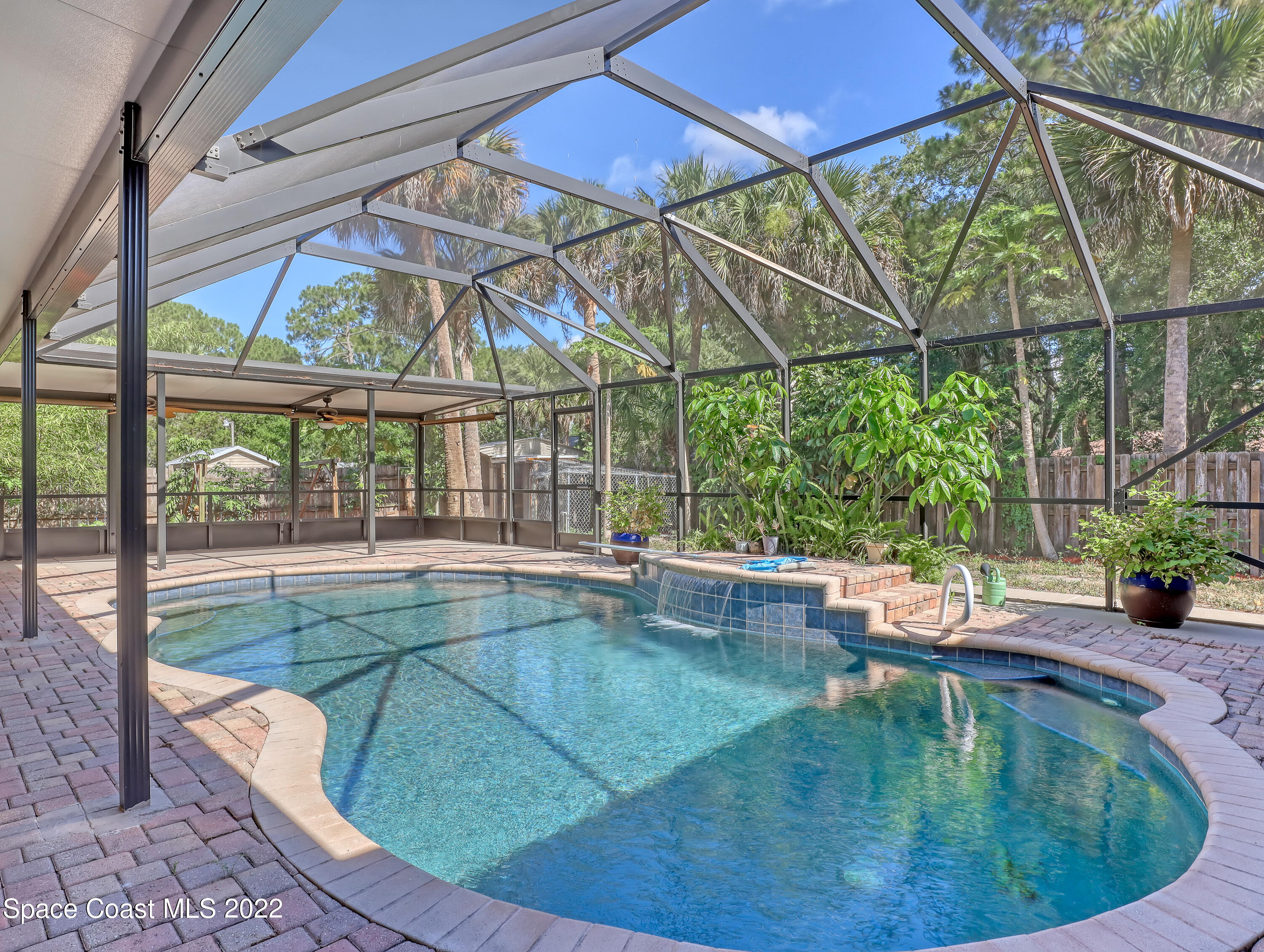 4764 Doreen Road Cocoa, FL 32927 - Photo 41 of 54 a view of swimming pool with outdoor seating