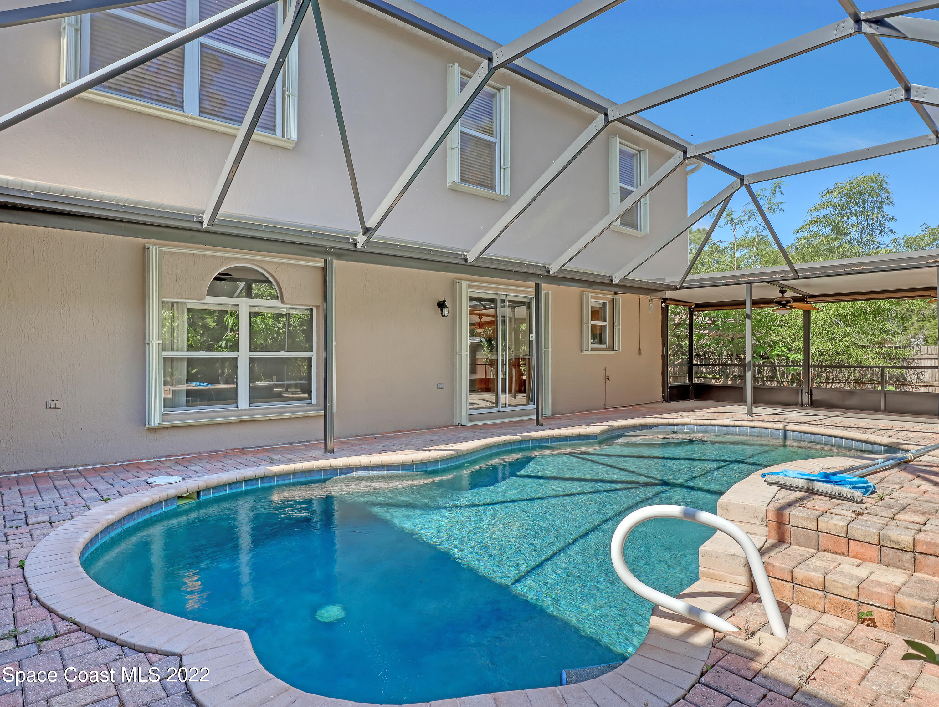 4764 Doreen Road Cocoa, FL 32927 - Photo 42 of 54 a view of a backyard with table and chairs