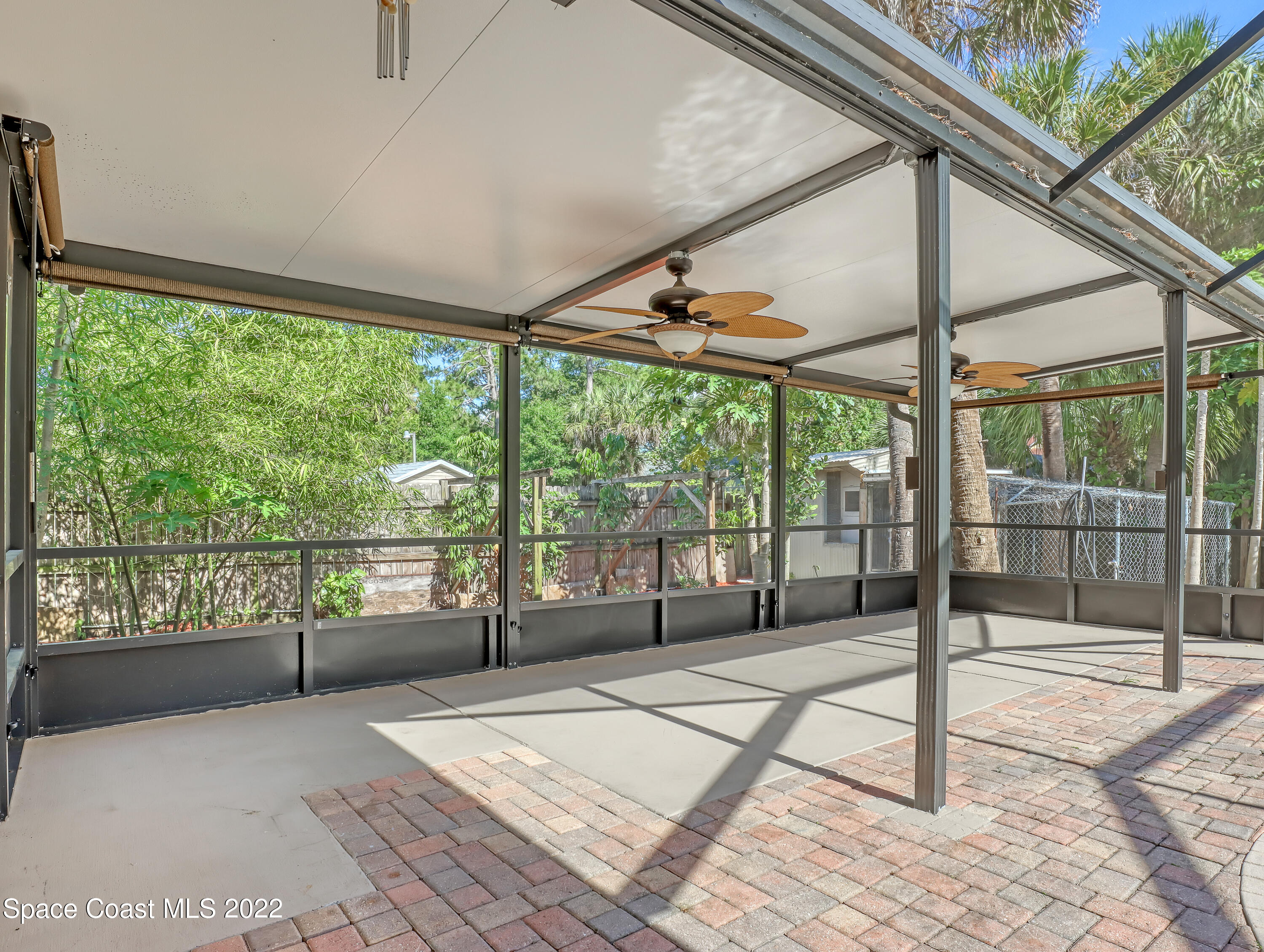 4764 Doreen Road Cocoa, FL 32927 - Photo 43 of 54 a bedroom with a bed and glass door
