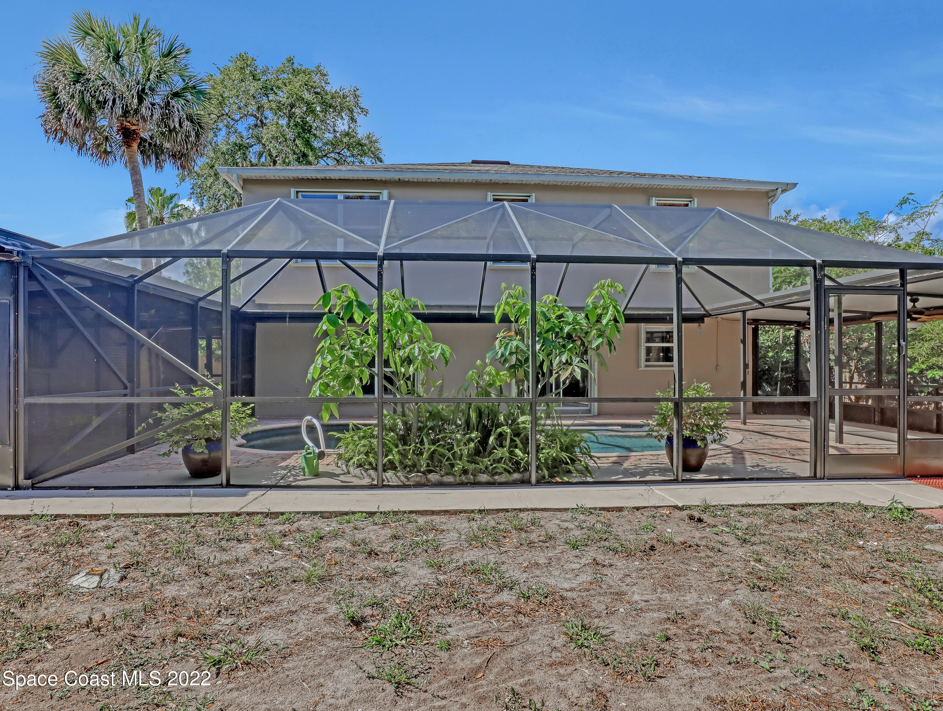 4764 Doreen Road Cocoa, FL 32927 - Photo 49 of 54 a view of a house with backyard and plants