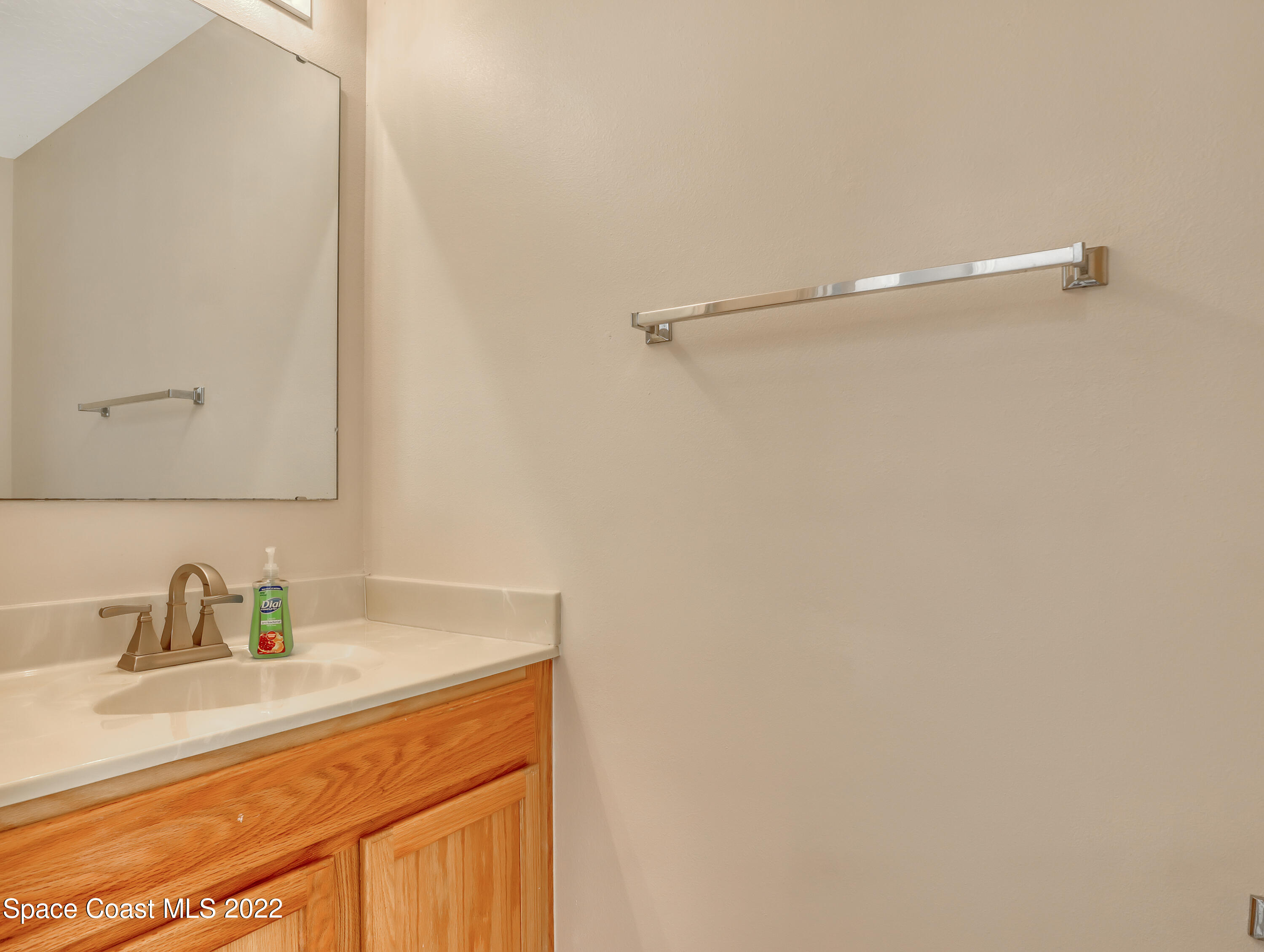 4764 Doreen Road Cocoa, FL 32927 - Photo 9 of 54 a bathroom with a sink and a mirror