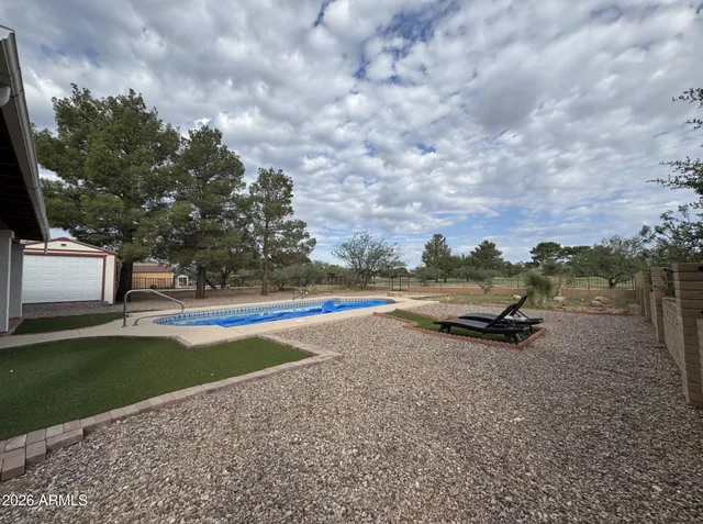 a view of an outdoor space with swimming pool