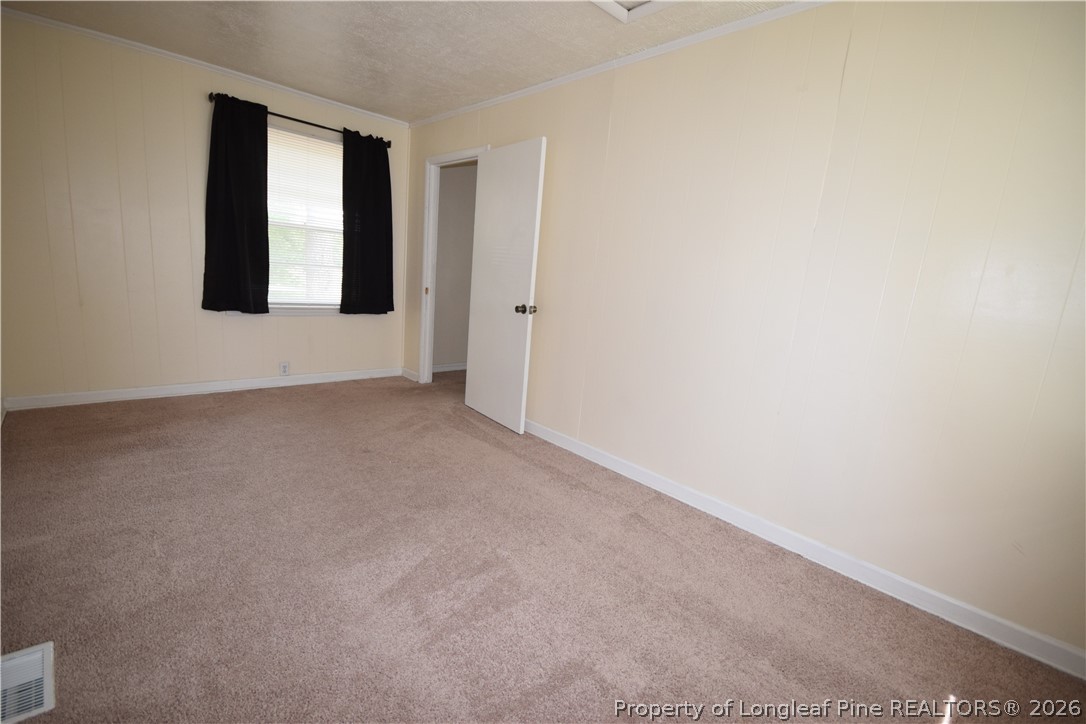 108 South 6th Street Spring Lake, NC 28390 - Photo 14 of 20 a view of an empty room with window