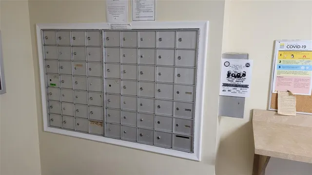 a kitchen with kitchen island a sink and a chandelier
