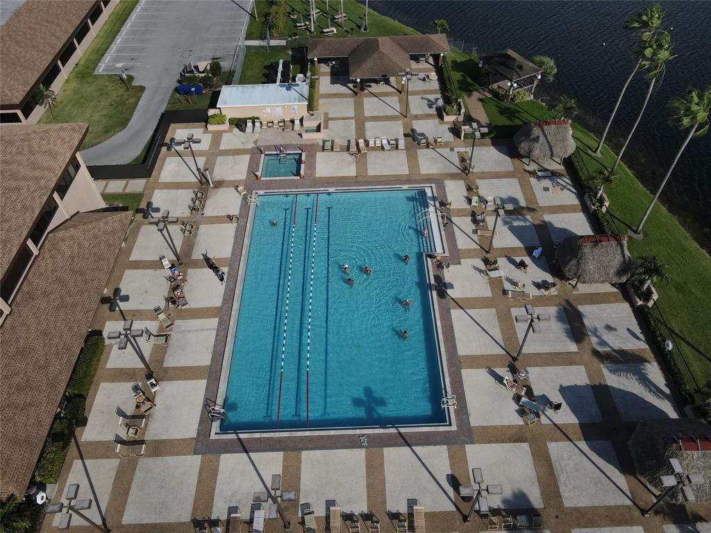 300 Southwest 134th Way, Unit E211 Pembroke Pines, FL 33027 - Photo 22 of 24 an aerial view of a residential houses with outdoor space