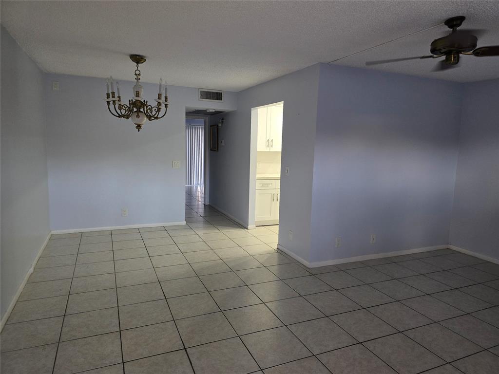 300 Southwest 134th Way, Unit E211 Pembroke Pines, FL 33027 - Photo 3 of 24 a view of an empty room and window