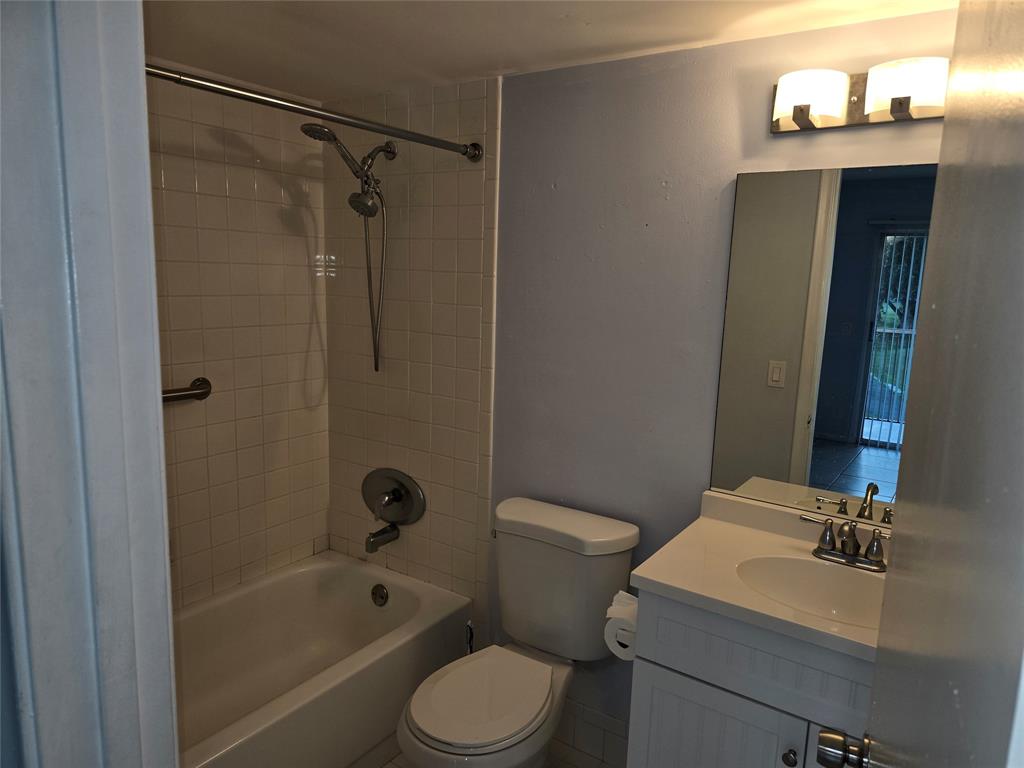 300 Southwest 134th Way, Unit E211 Pembroke Pines, FL 33027 - Photo 6 of 24 a bathroom with a sink a toilet and shower