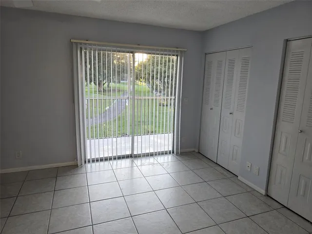 a view of empty room with sliding door