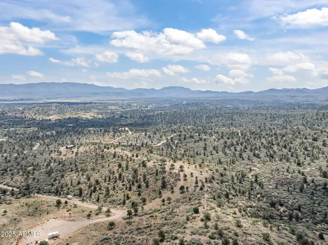 a view of a dry yard covered with snow