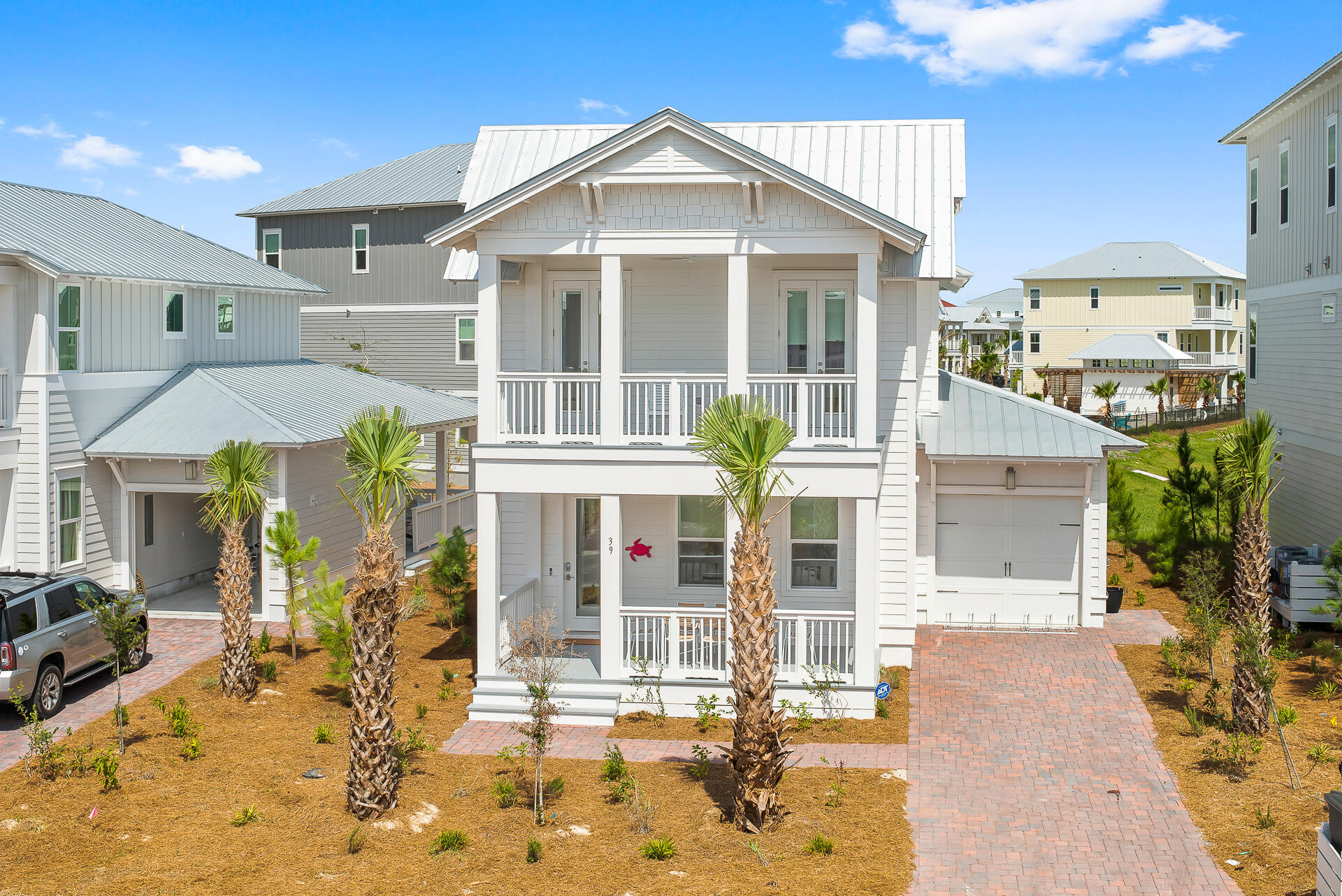 39 Candlehouse Ln Inlet Beach Inlet Beach, FL 32461 - Photo 1 of 26 a front view of a house with a yard