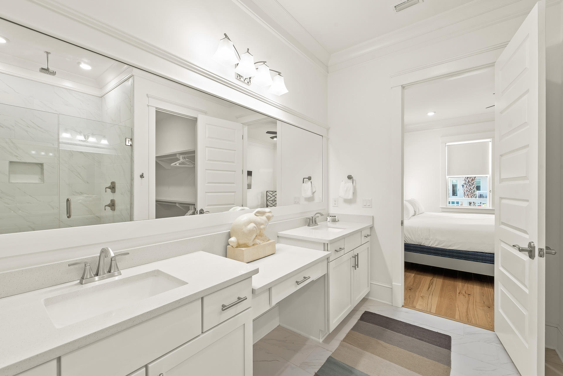 39 Candlehouse Ln Inlet Beach Inlet Beach, FL 32461 - Photo 11 of 26 a spacious bathroom with a double vanity sink and mirror