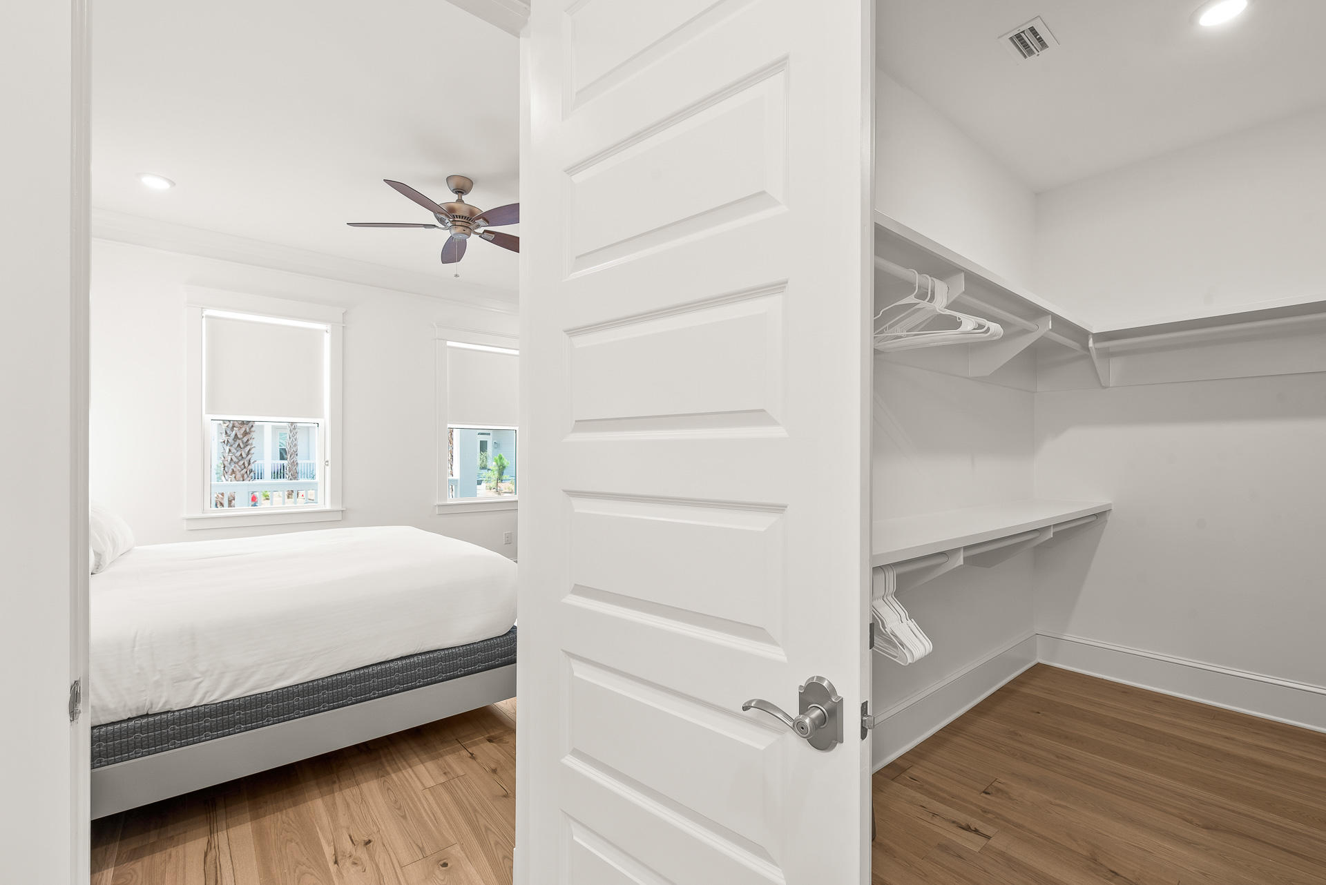 39 Candlehouse Ln Inlet Beach Inlet Beach, FL 32461 - Photo 13 of 26 a bedroom with a bed and a chandelier