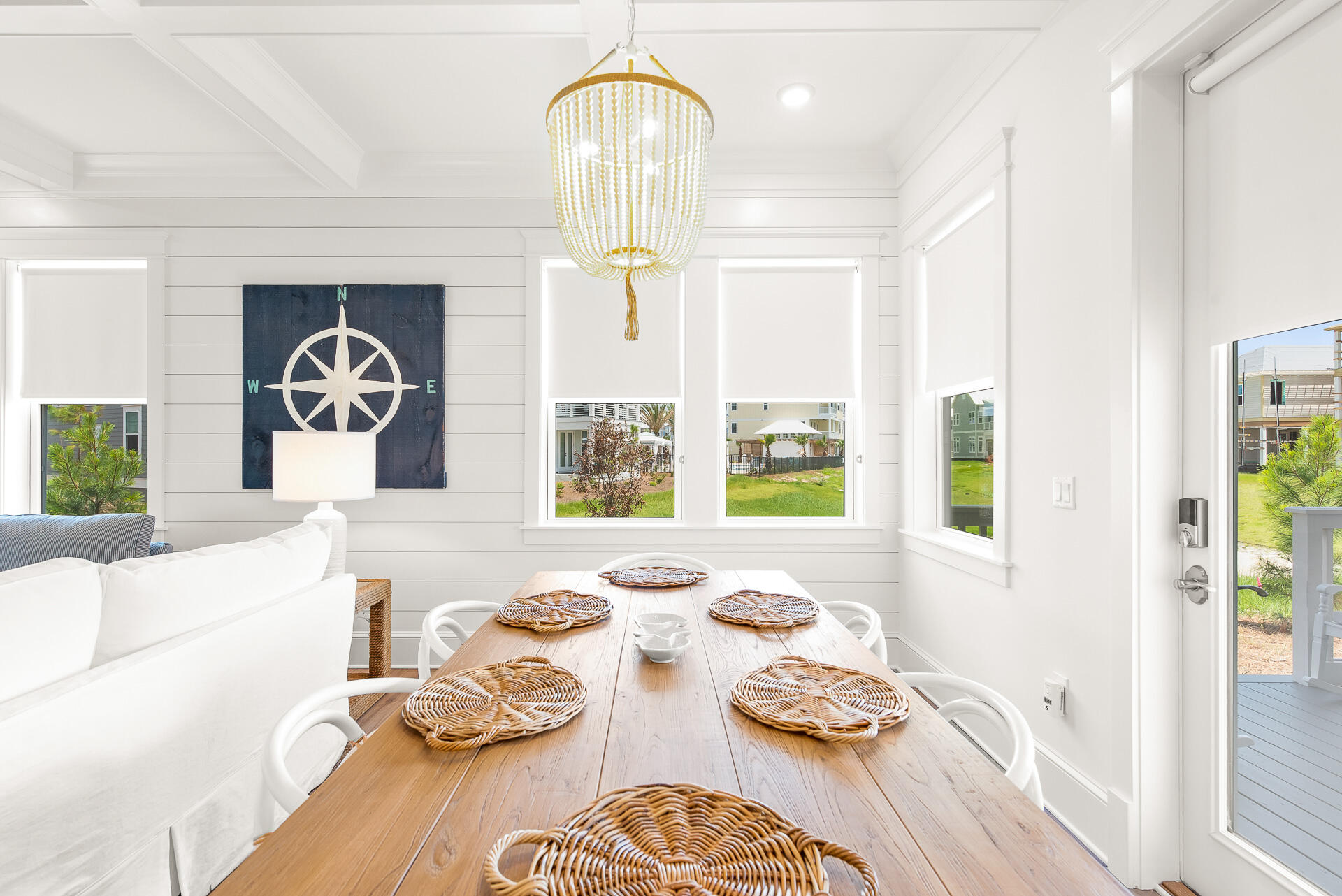 39 Candlehouse Ln Inlet Beach Inlet Beach, FL 32461 - Photo 3 of 26 a view of a dining room with furniture a chandelier and wooden floor