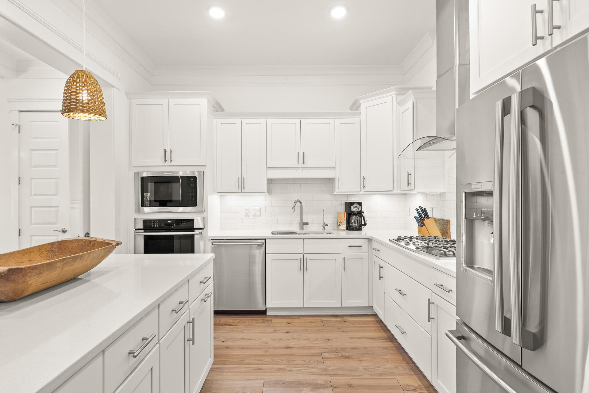 39 Candlehouse Ln Inlet Beach Inlet Beach, FL 32461 - Photo 7 of 26 a kitchen with white cabinets and stainless steel appliances