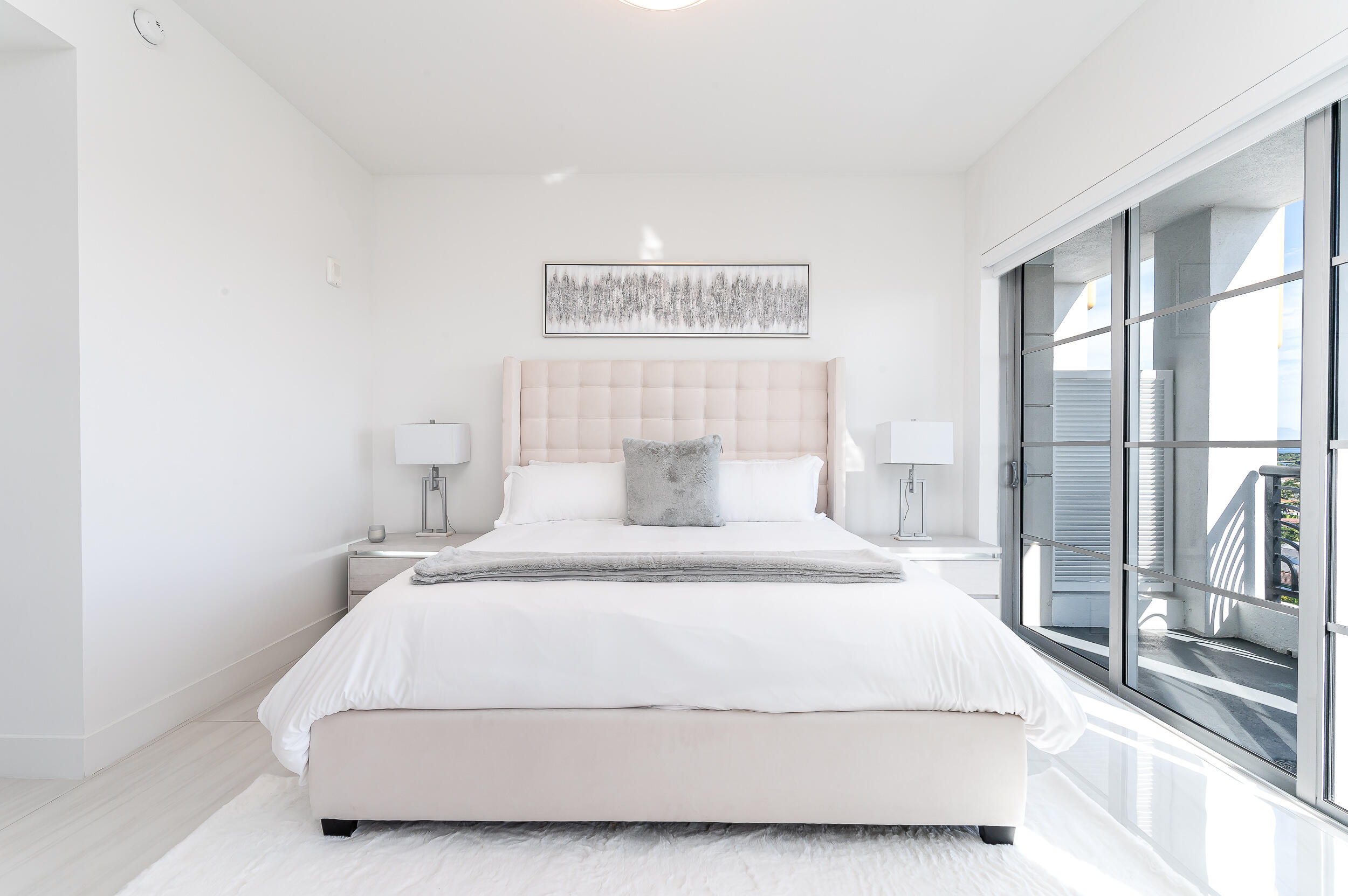 155 East Boca Raton Road, Unit 1103 Boca Raton, FL 33432 - Photo 21 of 57 a bedroom with a bed and glass walk in closet