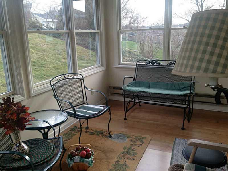 1817 Borland Road Pittsburgh, PA 15243 - Photo 3 of 19 Sunroom. Nice Laminate Flooring brightens up the room.