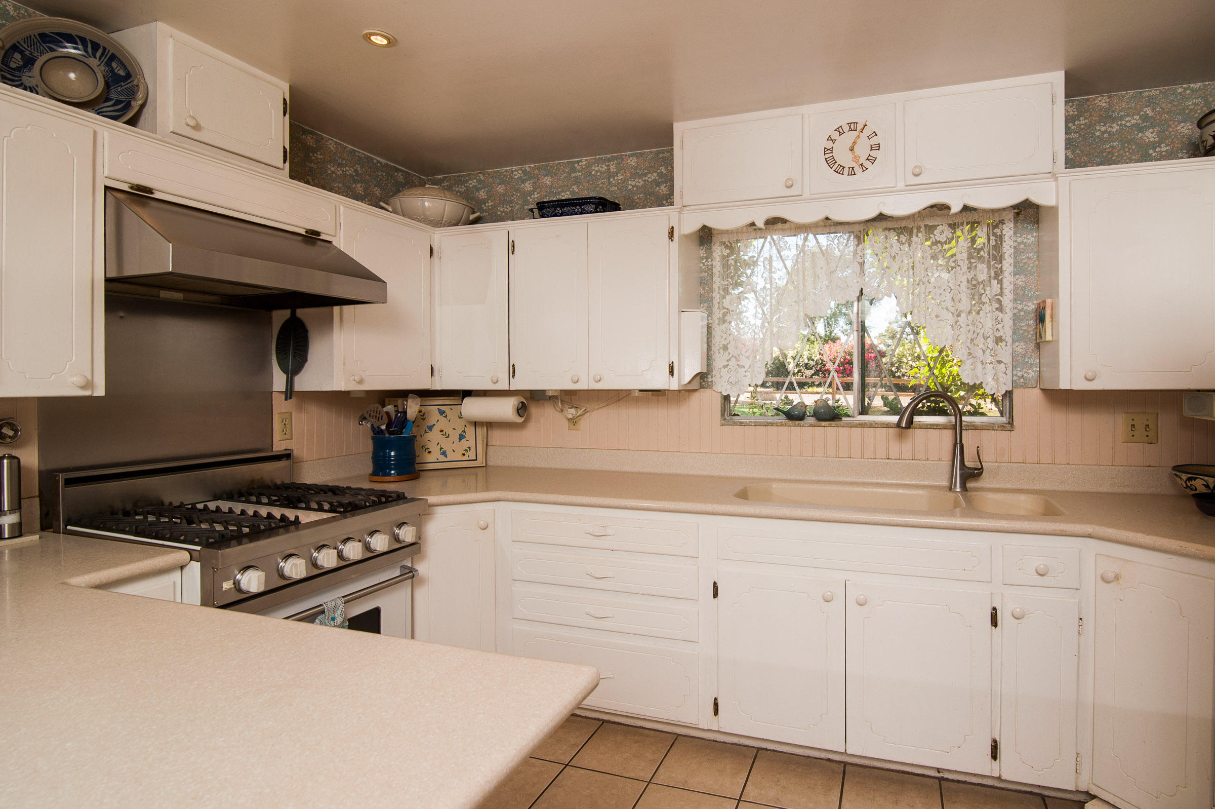 2620 Janin Way Solvang, CA 93463 - Photo 15 of 24 a kitchen with granite countertop a sink a stove and cabinets