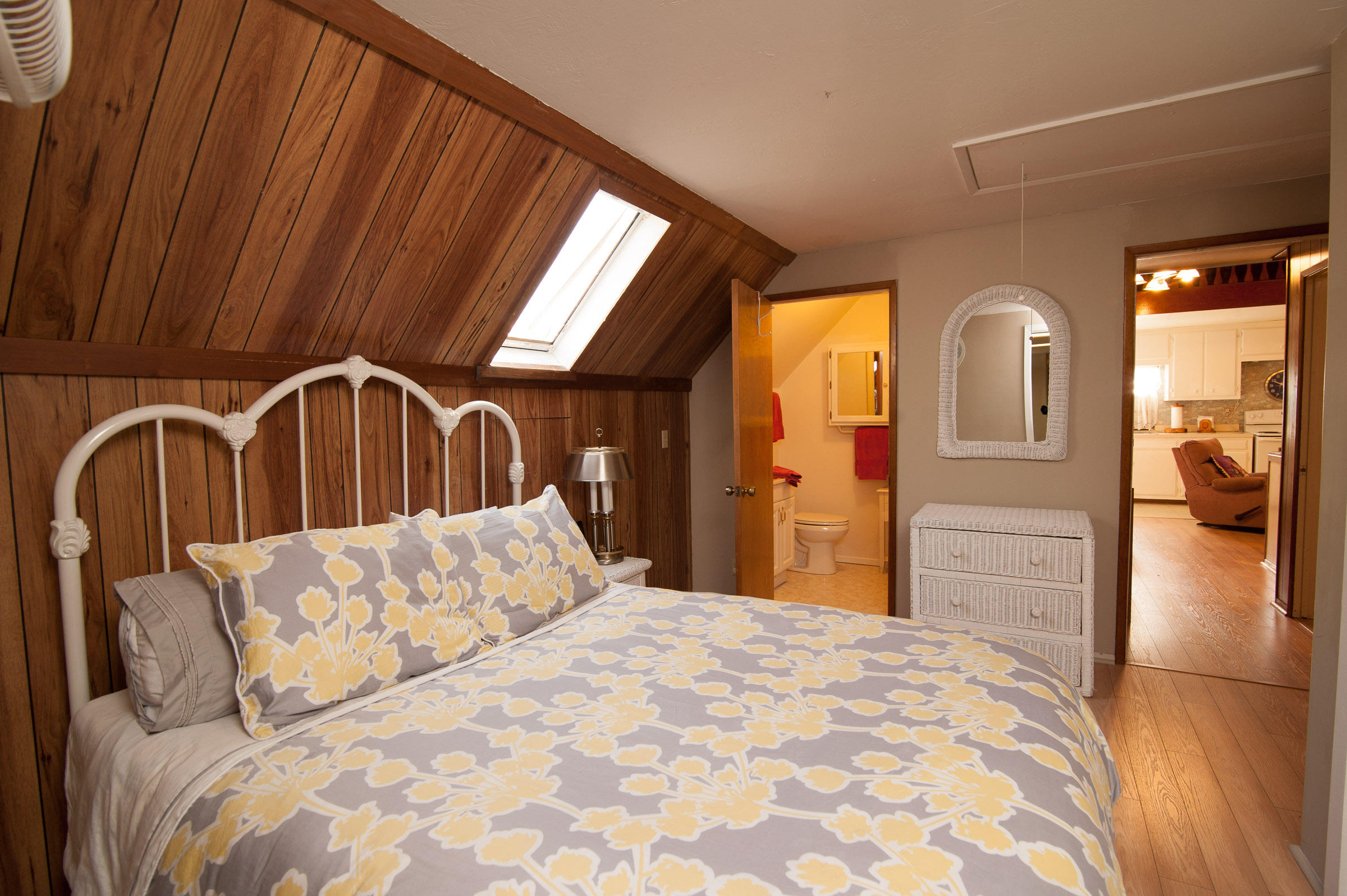 2620 Janin Way Solvang, CA 93463 - Photo 20 of 24 a bedroom with a bed and dresser with mirror