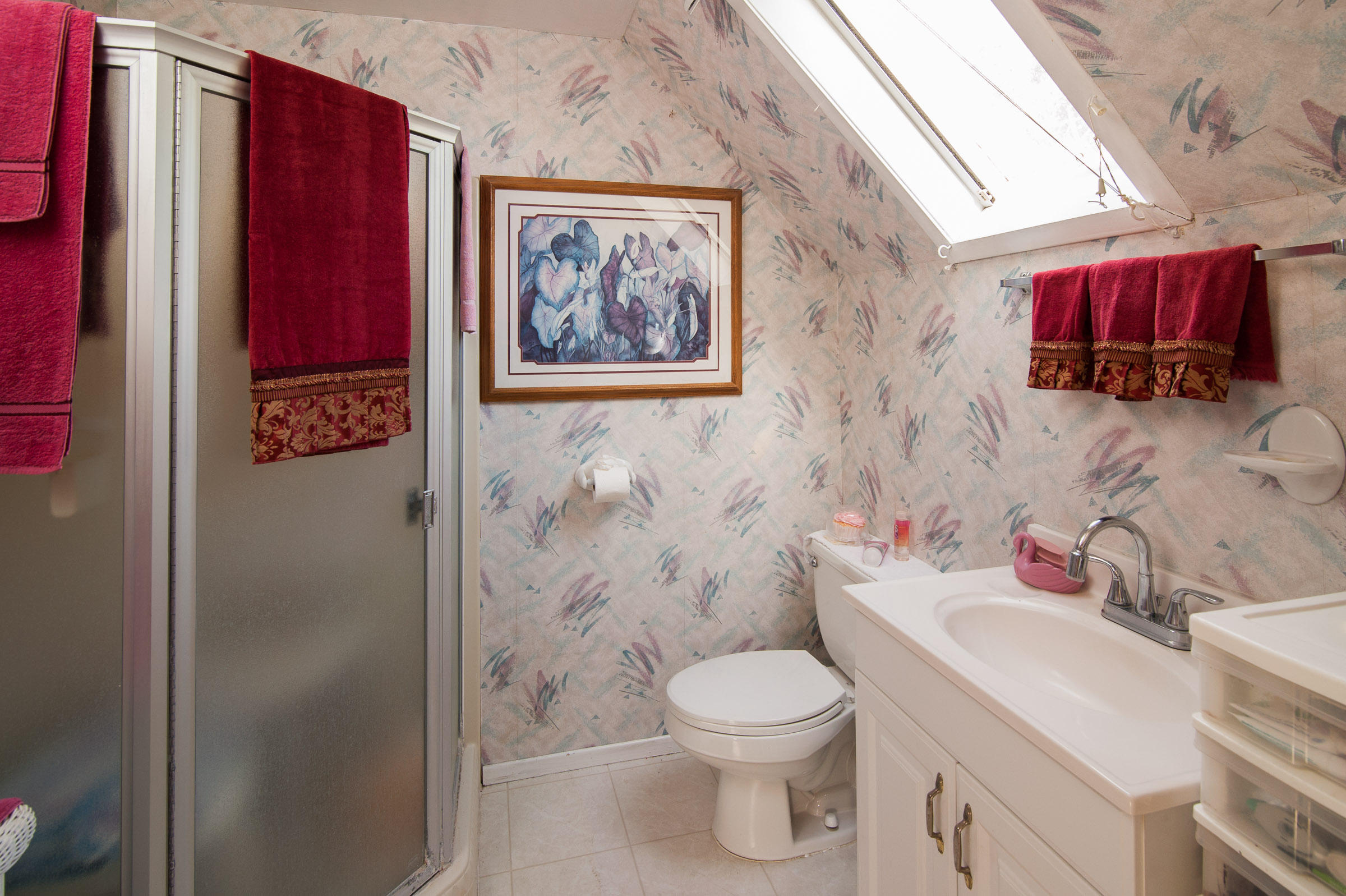 2620 Janin Way Solvang, CA 93463 - Photo 23 of 24 a bathroom with a toilet and a shower curtain