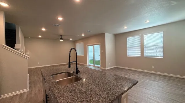 a kitchen with sink and window