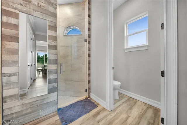 wooden floor in a gallery with a bathroom