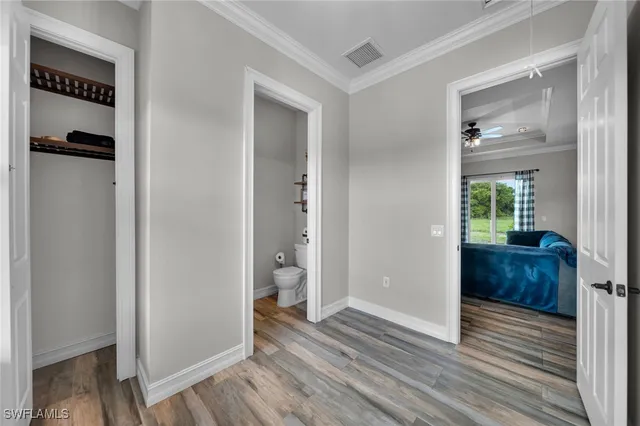 a view of hallway with wooden floor