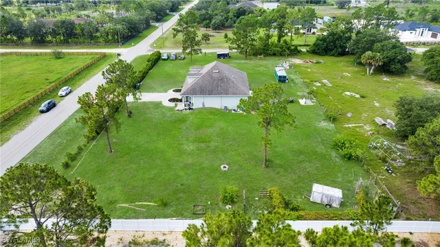 a aerial view of a house with a yard