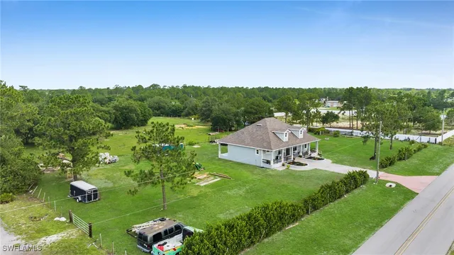 a view of a garden with a house