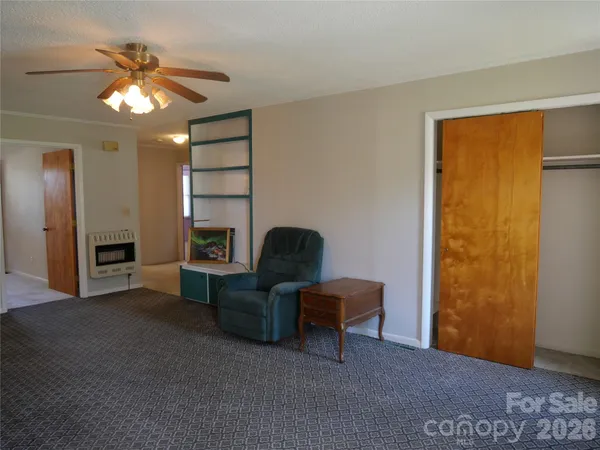 a view of workspace with window and hallway