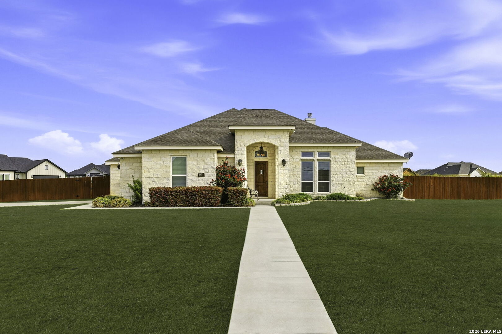 a front view of a house with yard