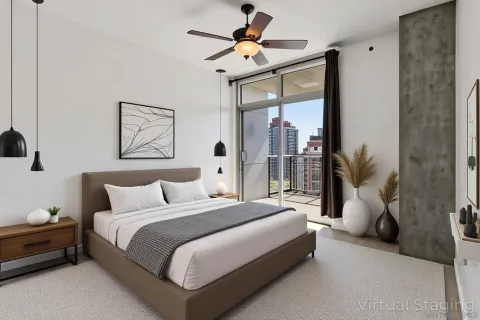 a view of a room with a ceiling fan and a window