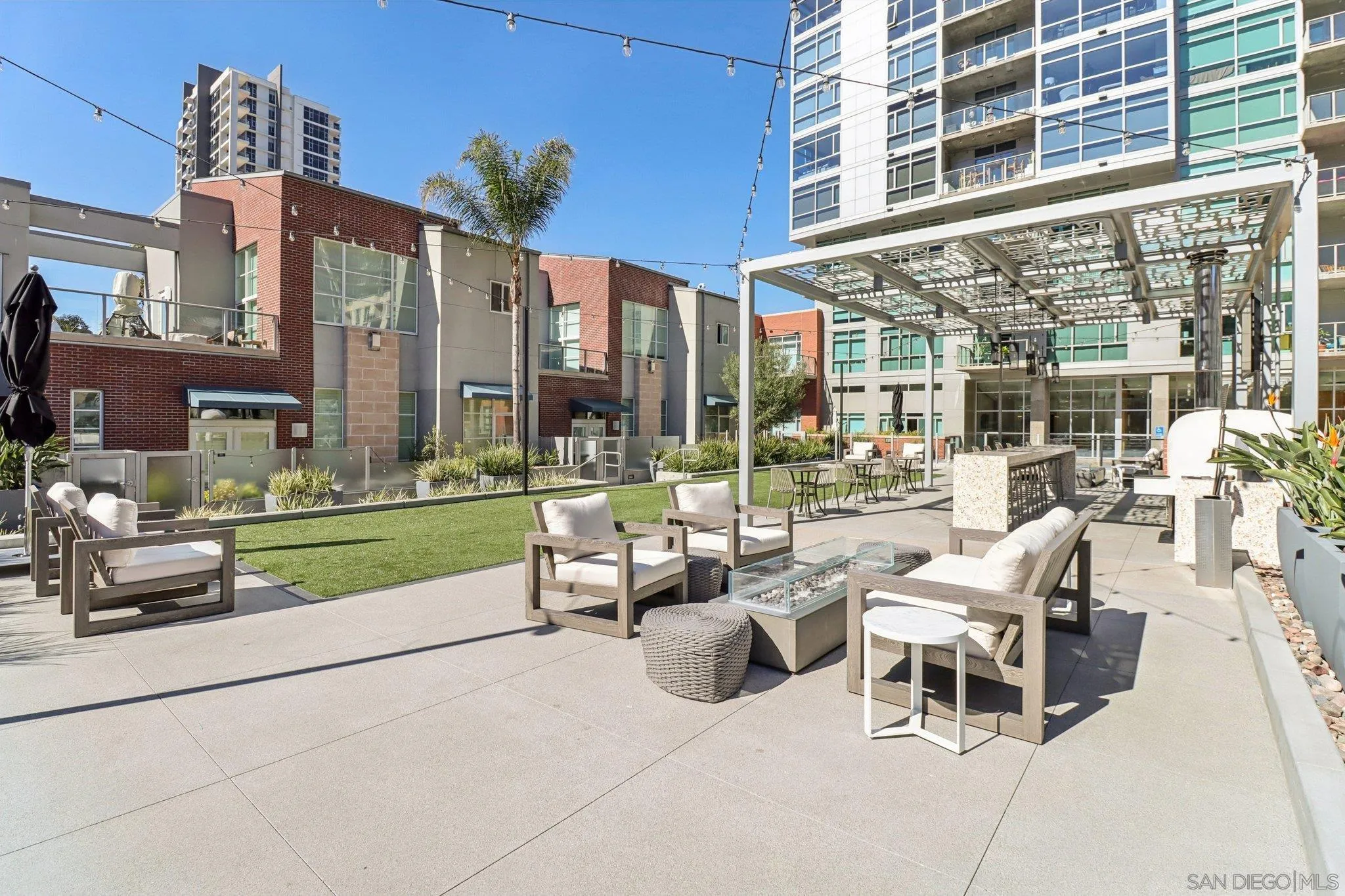 800 The Mark Lane, Unit 1606 San Diego, CA 92101 - Photo 39 of 50 a view of a patio with couches and a table and chairs