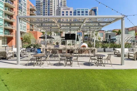 a swimming pool with outdoor seating and yard