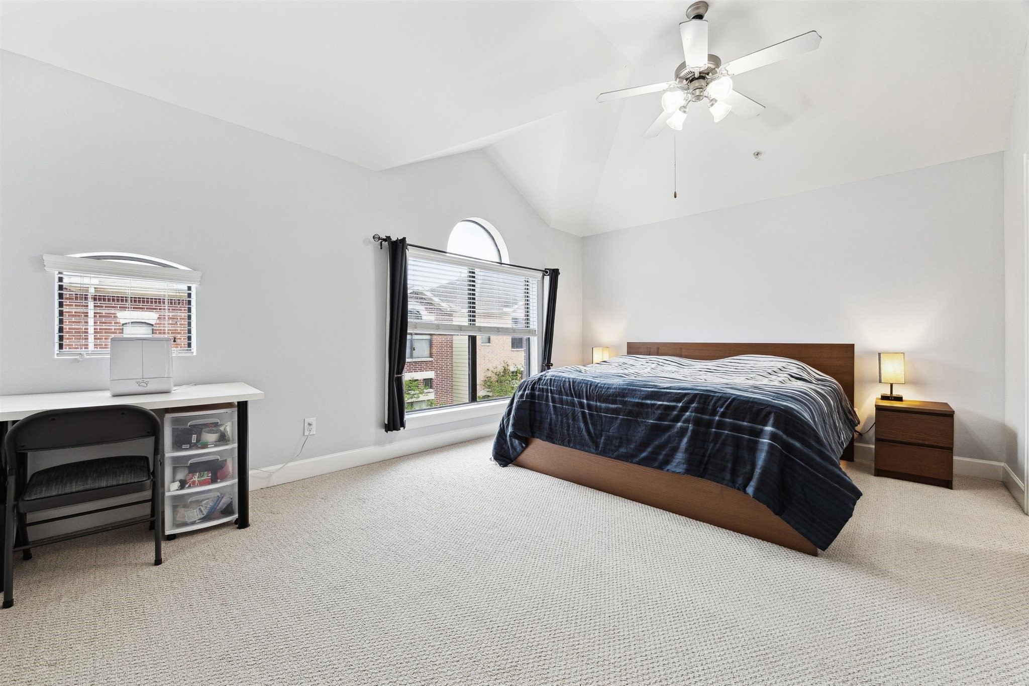 11315 South Main Street, Unit 1401 Houston, TX 77025 - Photo 7 of 14 a bedroom with a bed and a desk