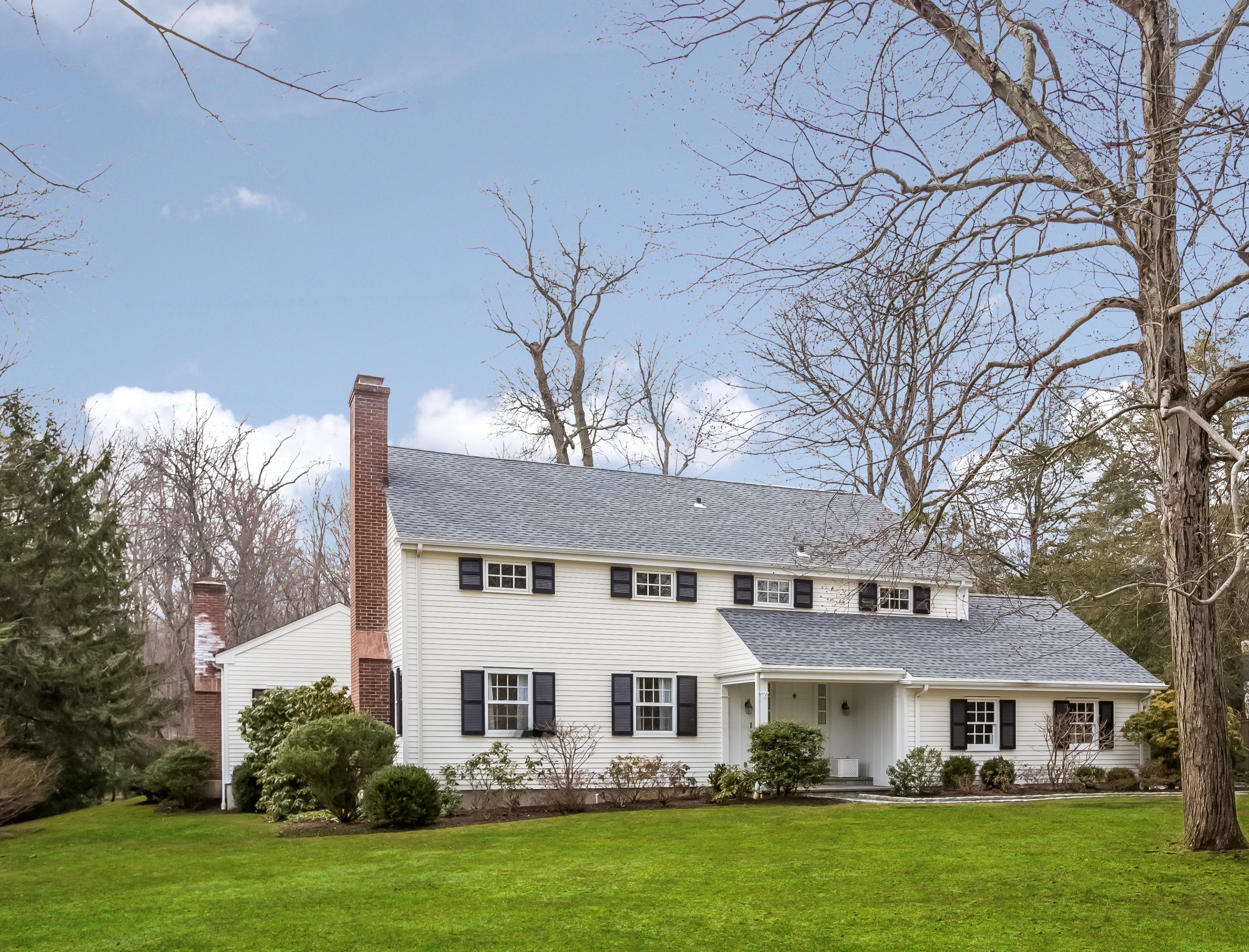 132 Colony Road Darien, CT 06820 - Photo 1 of 25 a front view of a house with a garden