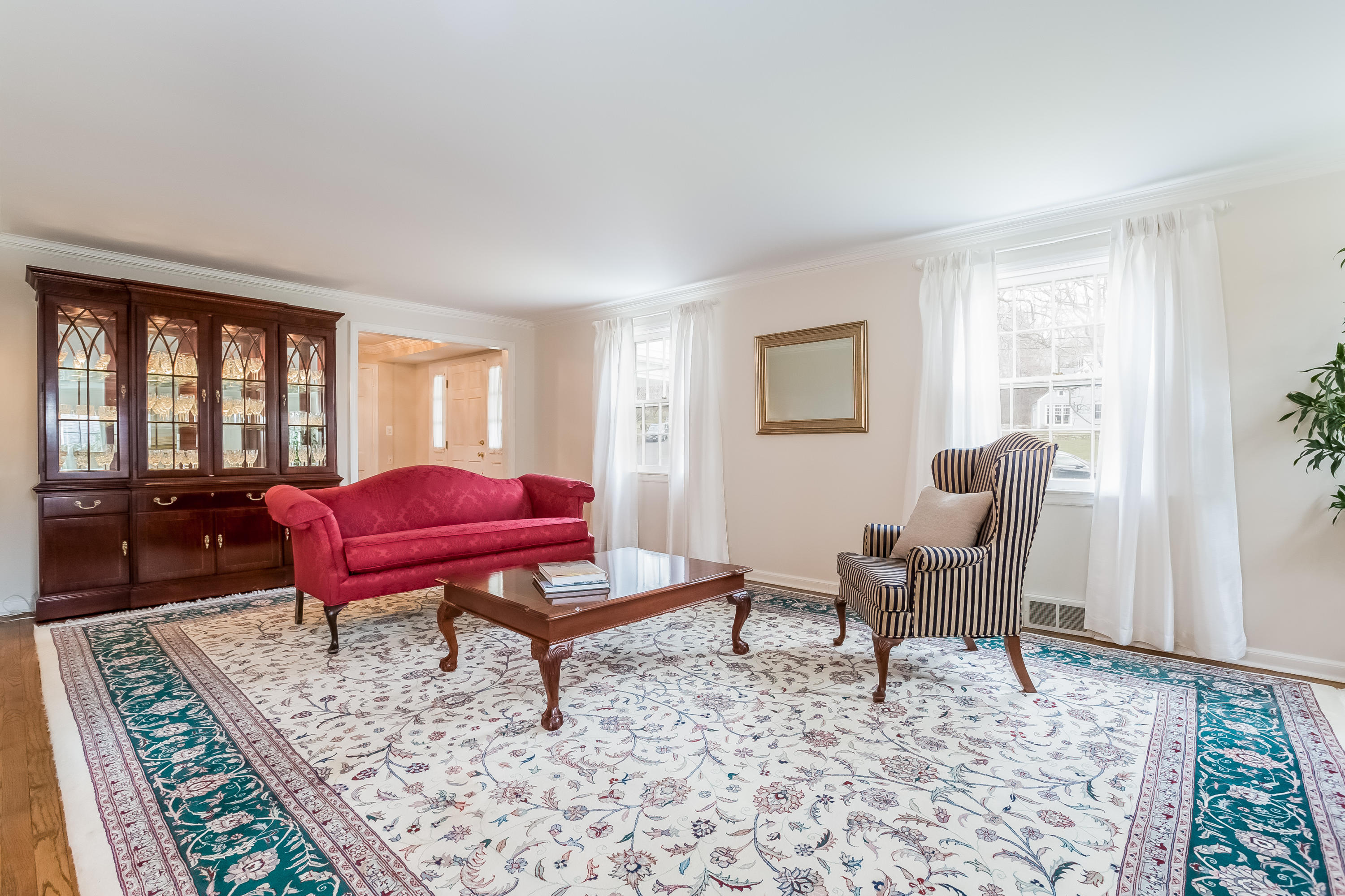 132 Colony Road Darien, CT 06820 - Photo 4 of 25 a living room with furniture a rug and a window