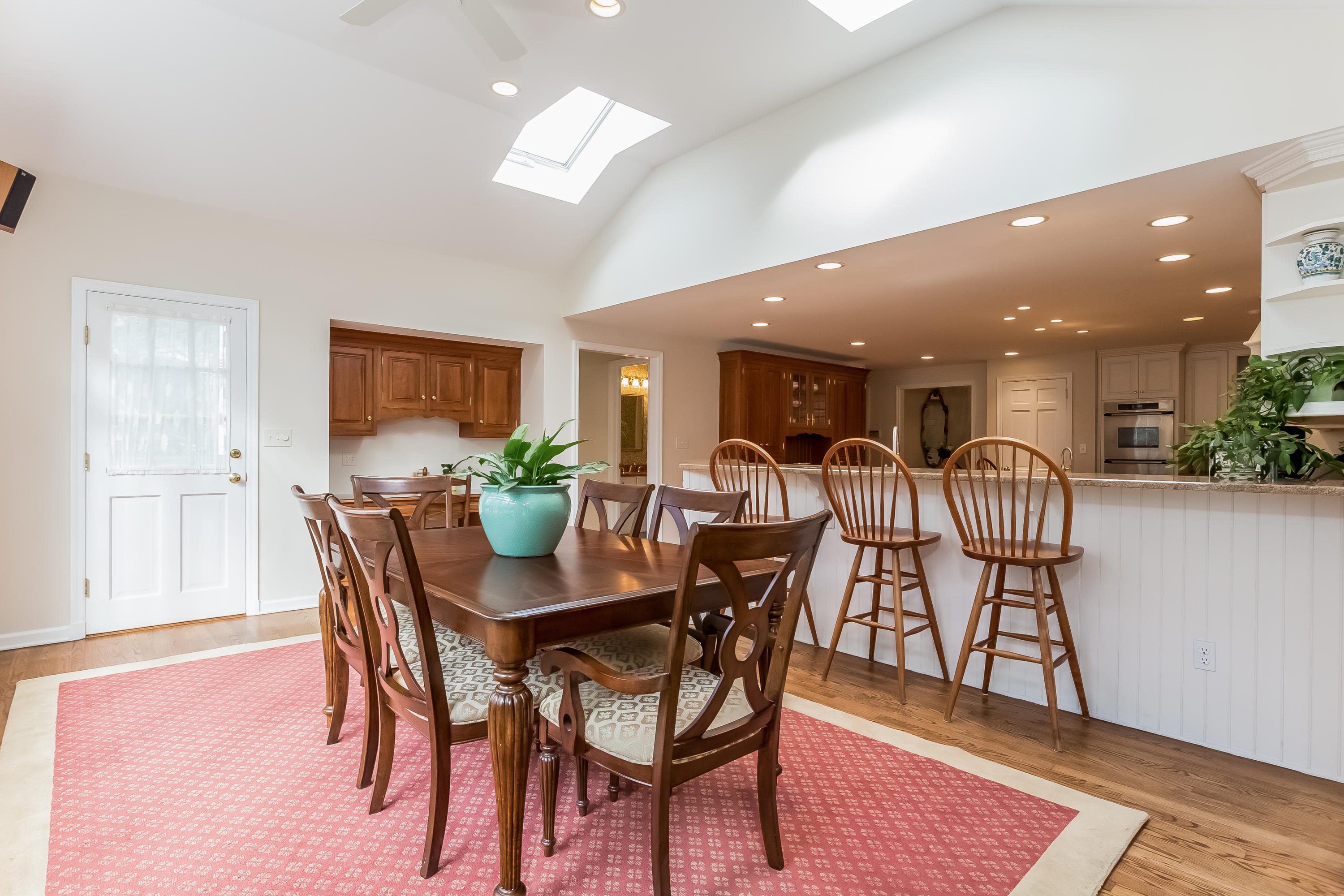 132 Colony Road Darien, CT 06820 - Photo 8 of 25 a view of a dining room with furniture and wooden floor