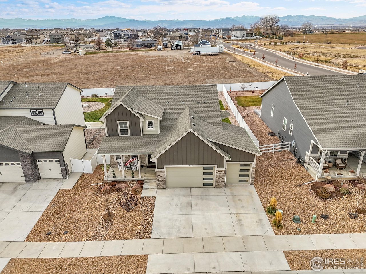 an aerial view of a house with lake view