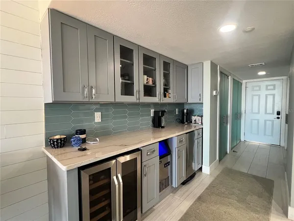 a kitchen with stainless steel appliances granite countertop a stove and a refrigerator