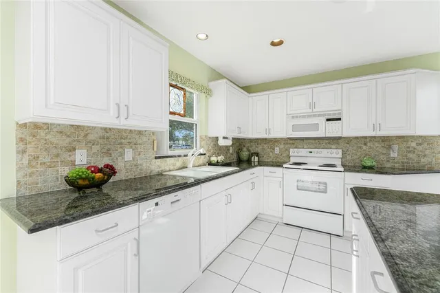 a kitchen with sink cabinets and window