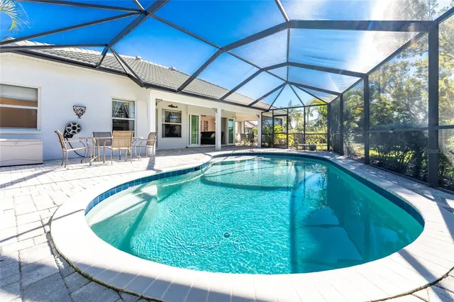 a view of a swimming pool with a patio