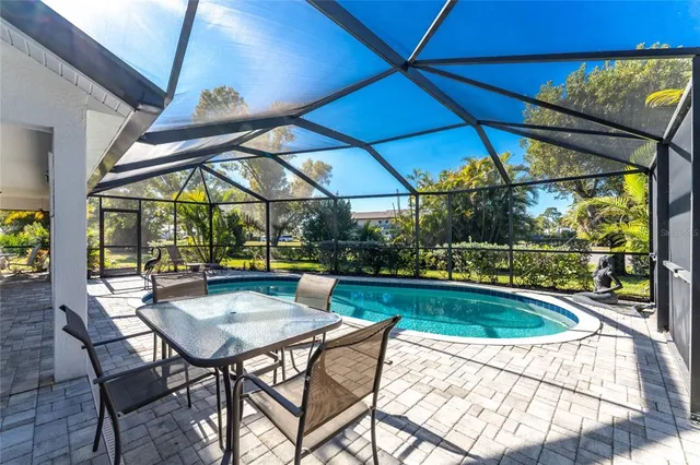 a view of patio with swimming pool