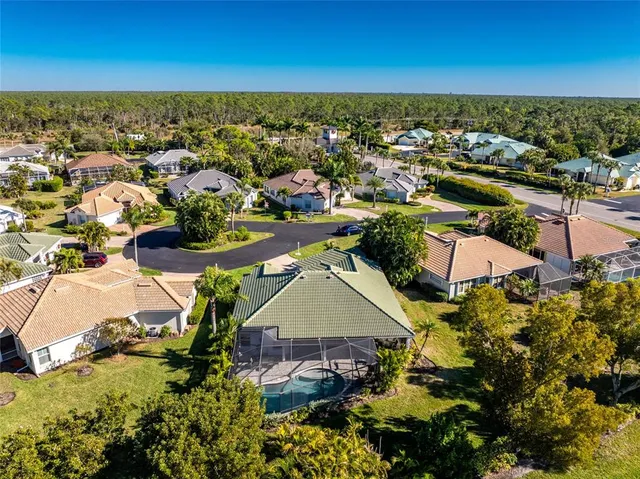 an aerial view of residential houses with outdoor space