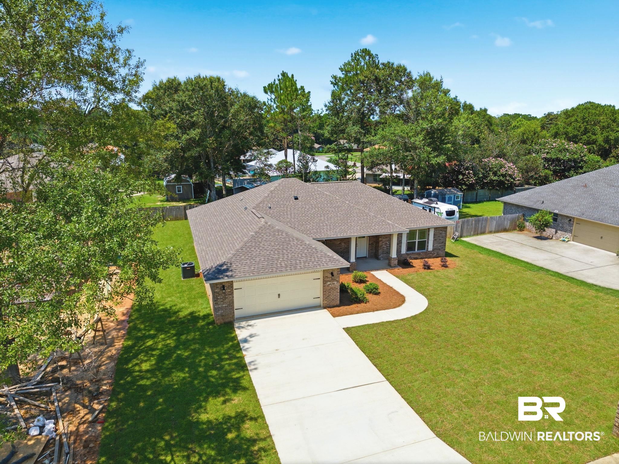 32656 Arbor Ridge Circle Lillian, AL 36549 - Photo 41 of 56 Traditional brick exterior with white columns and a gabled roof