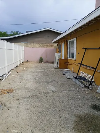 a backyard of a house with shaded area