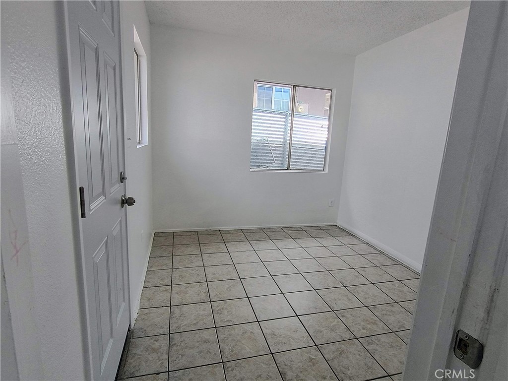 12873 Cactus Drive, Unit A Desert Hot Springs, CA 92240 - Photo 4 of 11 a view of an empty room and window