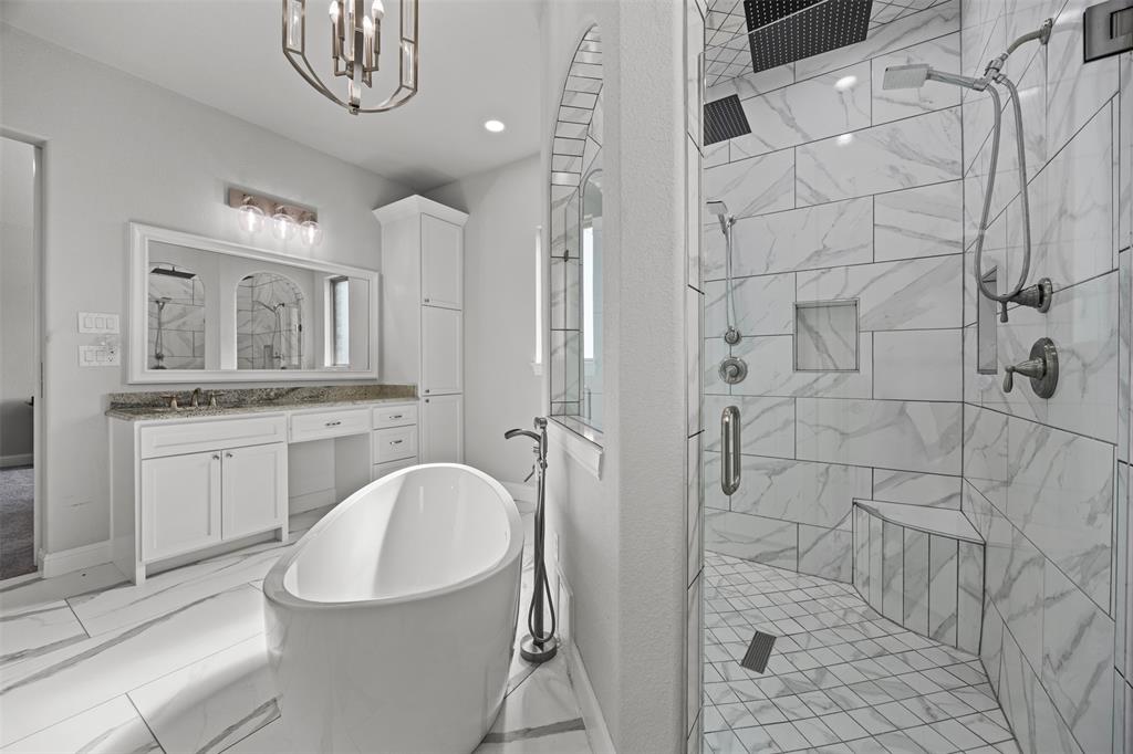 6381 Rigel Road Godley, TX 76044 - Photo 29 of 40 a bathroom with a sink a toilet and shower