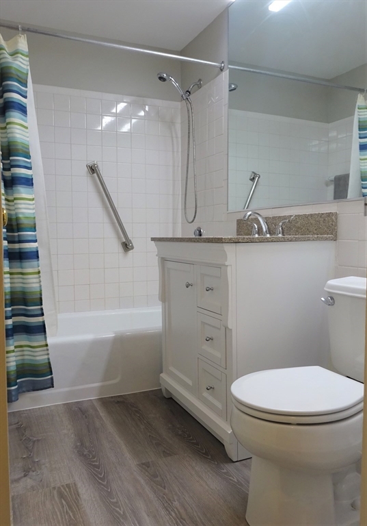 1321 Worcester Road, Unit 610 Framingham, MA 01701 - Photo 13 of 30 a bathroom with a sink a toilet and shower